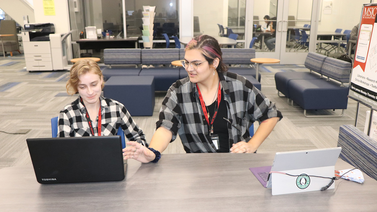 student with tutor in the LRC