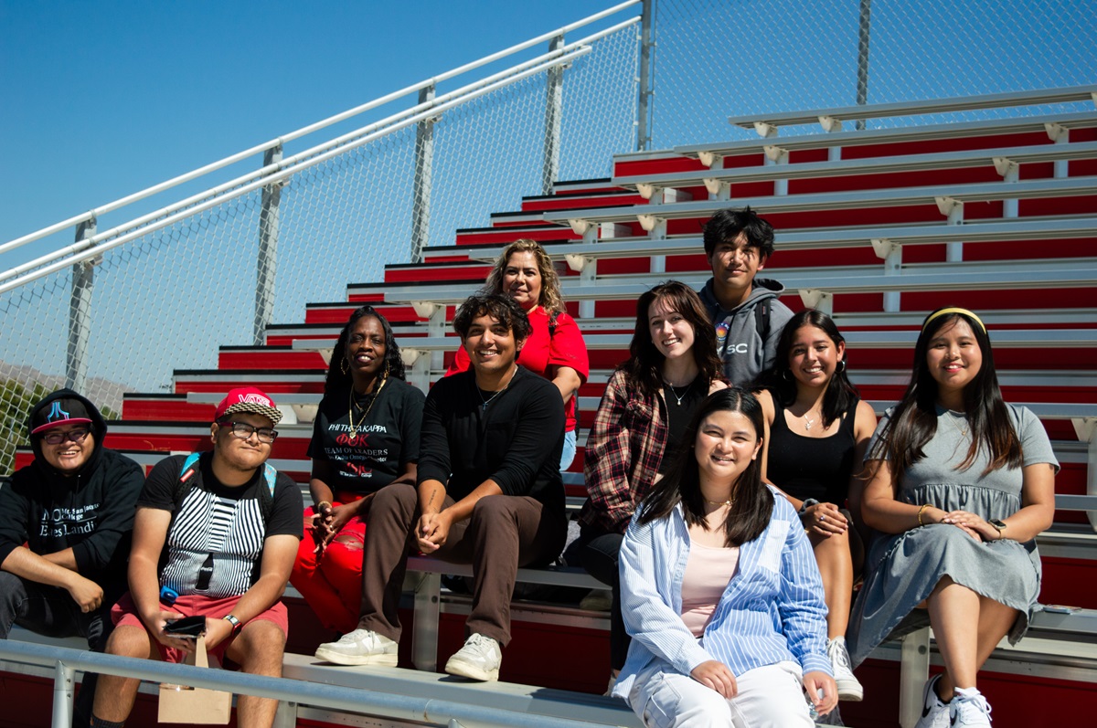 students smiling sitting in the stands